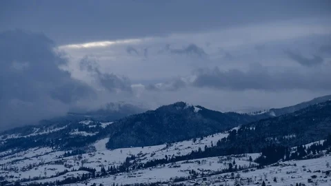 Time lapse of clouds running over white snowy mountain landscape. Winter moun Stock Footage 100742736