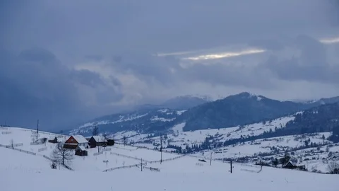 Time lapse of clouds running over white snowy mountain landscape. Winter moun Stock Footage 100742742