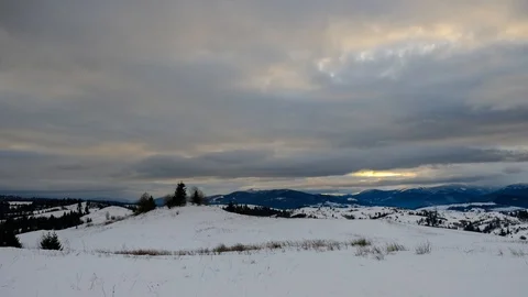 Time lapse of clouds running over white snowy mountain landscape. Winter moun Stock Footage 100742744
