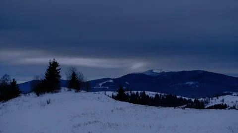 Time lapse of clouds running over white snowy mountain landscape. Winter moun Stock Footage 100742751
