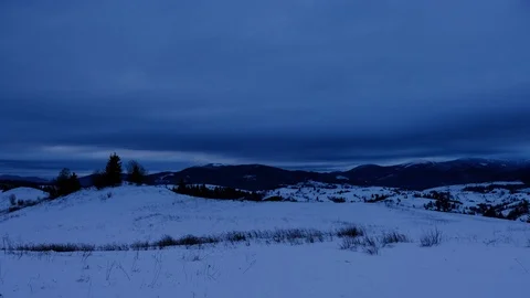 Time lapse of clouds running over white snowy mountain landscape. Winter moun Stock Footage 100742754