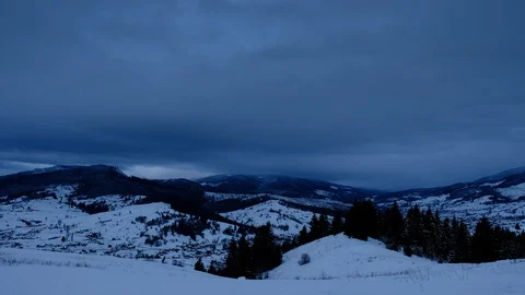 Time lapse of clouds running over white snowy mountain landscape. Winter moun Stock Footage 100742761