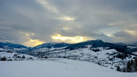 Time lapse of clouds running over white snowy mountain landscape. Winter moun Stock Footage 100742781