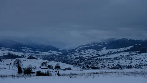 Time lapse of clouds running over white snowy mountain landscape. Winter moun Stock Footage 100742790