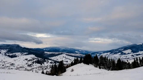 Time lapse of clouds running over white snowy mountain landscape. Winter moun Stock Footage 100742791
