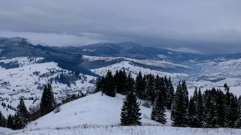 Time lapse of clouds running over white snowy mountain landscape. Winter moun Stock Footage 100742800