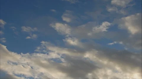 Time lapse clouds sail across a baby blue sky Stock Footage 246172254