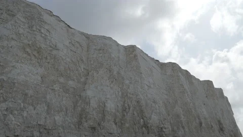 Time lapse. Clouds shifting over a white cliff. Stock Footage 128706689