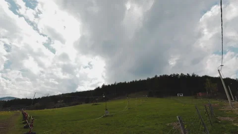 Time lapse of a clouds. ski trail in the mountains on a summer day Stock Footage 196866836