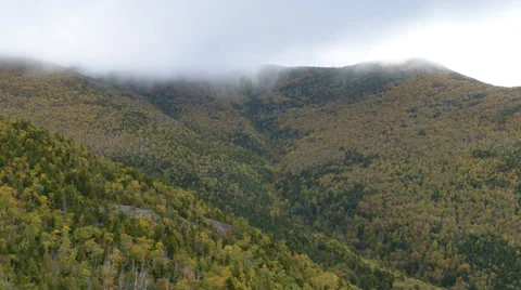 TIME LAPSE Clouds Skimming Top of Mountain Video stock 33464611