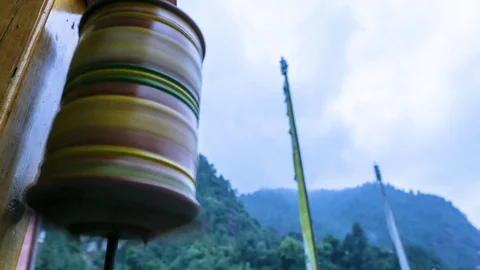 Time-lapse of clouds in the sky and prayer wheel in the temple Stock Footage 77452262