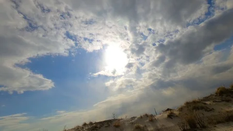 Time Lapse clouds in sky over sand dune at Gilgo Beach Stock Footage 106150668