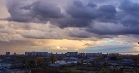 Time lapse of clouds in the sky over the buildings. Beautiful landscape Stock Footage 255140885