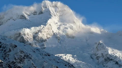 Time-lapse of clouds on the snow covered mountain Видео 116749755