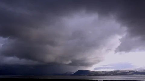 Time lapse Clouds in stormy sky with mountains in background UK 4K 스톡 동영상 104906460