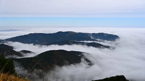 Time-lapse clouds streaming over the mountains in German Alps 스톡 동영상 219206925