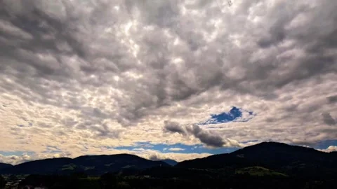 Time lapse of clouds with sun over mountains Stock Footage 315411497