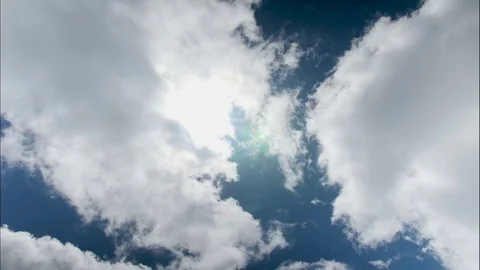 Time lapse, Clouds with Sun Rays Peeking Through, 4K Video stock 76989894