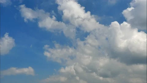Time lapse clouds on sunny blue sky Stock Footage 132765400