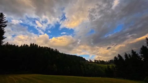 Time lapse of clouds on a sunset with forest Stock Footage 315118218