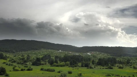 Time lapse clouds sweep above German village houses - Cumulus and Thunderheads Vídeo Stock 339593517