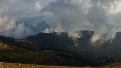 Time lapse of clouds swirling and rising over the mountains. The birth of clouds Stock Footage 120184439