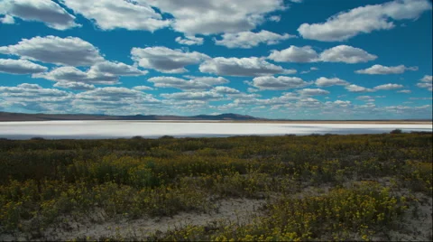 Time lapse clouds travel over Soda Lake salt flats - Time Lapse 2058 HD, 4K Stock Footage 62008130