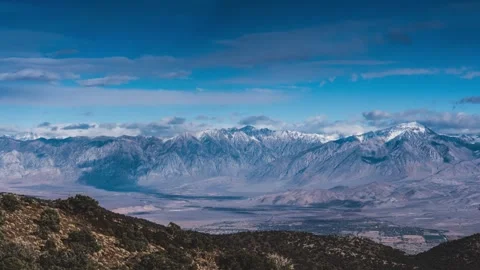 Time lapse clouds travel over the high sierra mountains, california Stock Footage 246172370