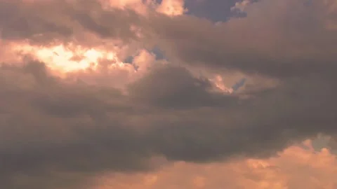 Time lapse clouds with yellow orange sunlight at sunset Stock Footage 138867466