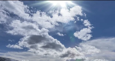 Time lapse of cloudscape behind of the mountains top. Snow, rocks, cliffs and Stock Footage 125597299