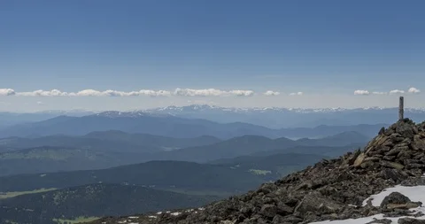 Time lapse of cloudscape behind of the mountains top. Snow, rocks, cliffs and Stock Footage 126288670