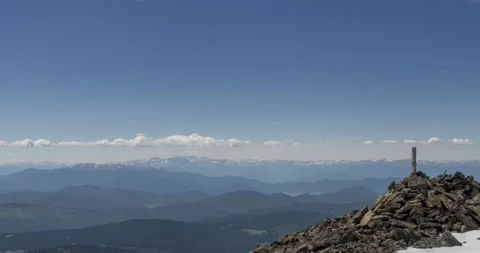 Time lapse of cloudscape behind of the mountains top. Snow, rocks, cliffs and Stock Footage 170328676