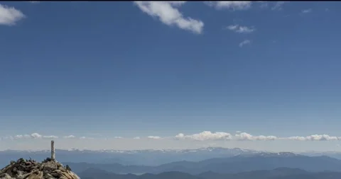 Time lapse of cloudscape behind of the mountains top. Snow, rocks, cliffs and Stock Footage 267841030