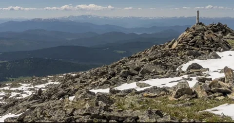 Time lapse of cloudscape behind of the mountains top. Snow, rocks, cliffs and Stock Footage 271506050