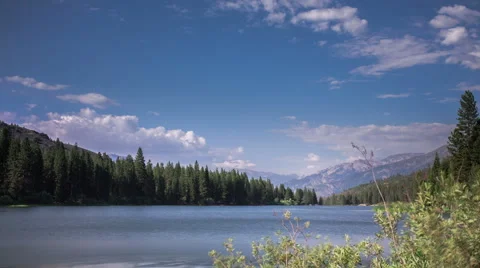 Time Lapse - Cloudscape of Hume Lake with Sail Boat Stock Footage 48430372