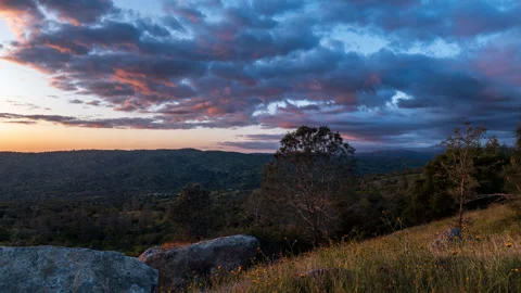 Time Lapse of Cloudscape Lit up By Sunset in California Mountains Stock Footage 278572006