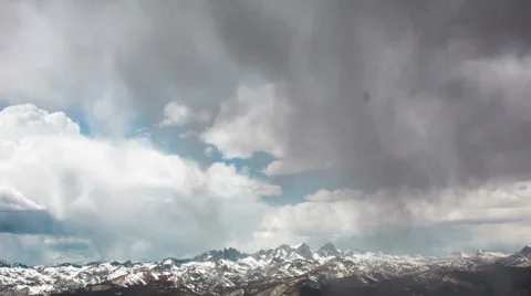 Time Lapse - Cloudscape Moving Over Snowy Mountain Top Stock Footage 49548049