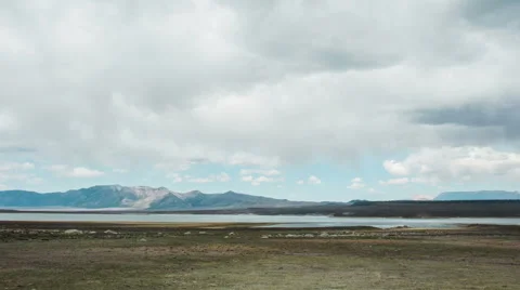 Time Lapse - Cloudscape Moving Over Mountains with River Vídeos de archivo 52491963