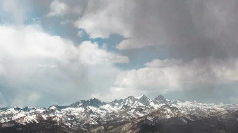 Time Lapse - Cloudscape Moving Over Snowy Mountains Stock Footage 52492089