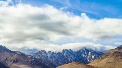 Time Lapse - Cloudscape Moving Over Snowy Mountain Range Stock Footage 59848982