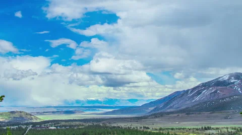 Time Lapse - Cloudscape Moving Over Snowy Mountain Range Stock Footage 64239979