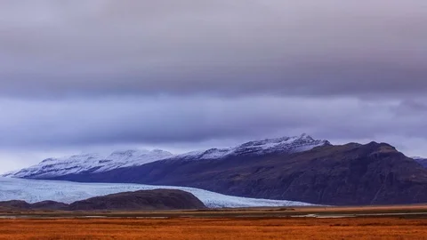 Time Lapse - Cloudscape over Snowcapped Mountains Stock Footage 69871385