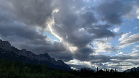 Time lapse of cloudscape with rocky mountains in the lower left corner Stock Footage 113950853