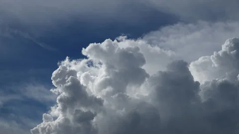Time-lapse of cloudscapes transform across a bright blue sky Video stock 279207541