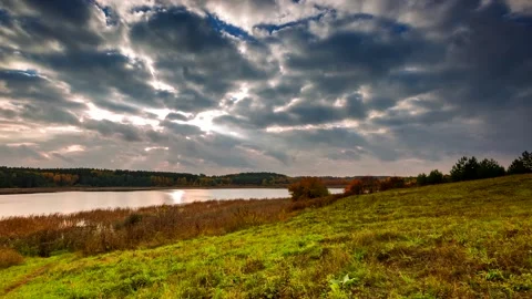 Time lapse of cloudy afternoon at lake. Autumnal 4k time lapse landscape. Stock Footage 154548936