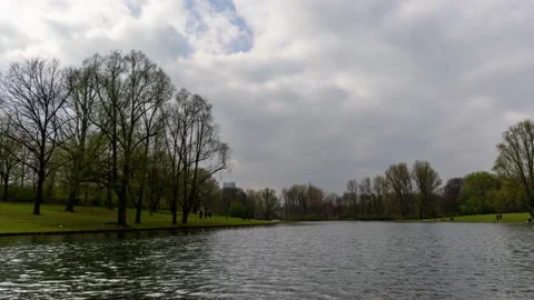 Time-lapse of a cloudy and windy day next to a lake Stock Footage 151592239