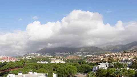 Time lapse of cloudy to blue sky in a residential area Stock Footage 285231586