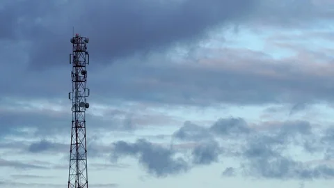 Time-lapse of Cloudy Dark Sky next to Cell Phone Tower Stock Footage 125397367