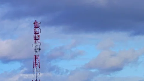 Time-lapse of Cloudy Dark Sky next to Cell Phone Tower 動画素材 125463426