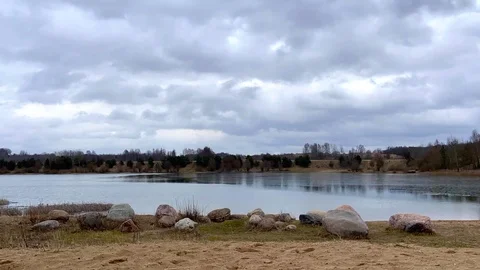 Time lapse of cloudy day on a lake Stock Footage